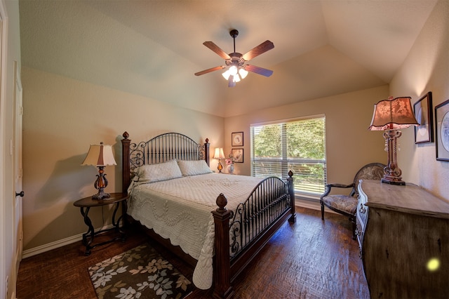 bedroom featuring lofted ceiling, dark wood-type flooring, and ceiling fan