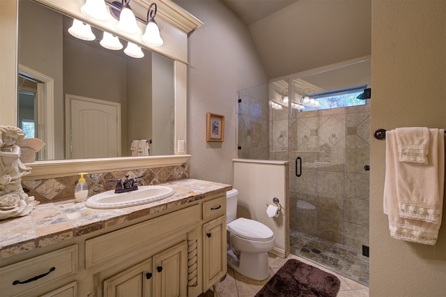 bathroom featuring vaulted ceiling, a shower with shower door, vanity, tile patterned flooring, and toilet