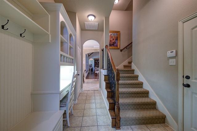 mudroom featuring light tile patterned flooring