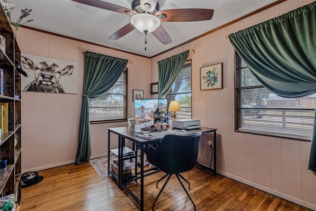 dining space featuring crown molding, ceiling fan, and hardwood / wood-style flooring