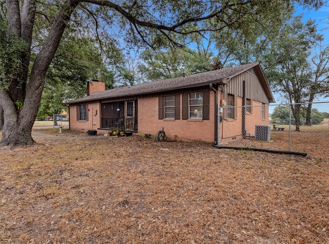 ranch-style house with cooling unit