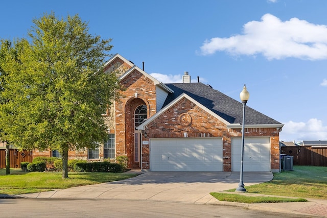 front facade featuring a front yard and a garage