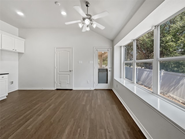 interior space with a wealth of natural light, vaulted ceiling, and ceiling fan