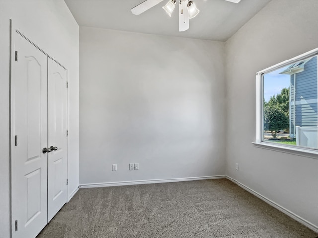 unfurnished bedroom featuring a closet, carpet, and ceiling fan