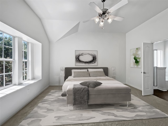 carpeted bedroom featuring ceiling fan and lofted ceiling