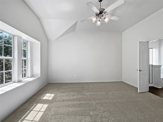 additional living space with ceiling fan, lofted ceiling, and light carpet