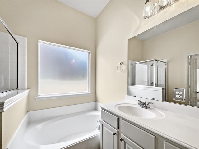 bathroom with shower with separate bathtub and vanity