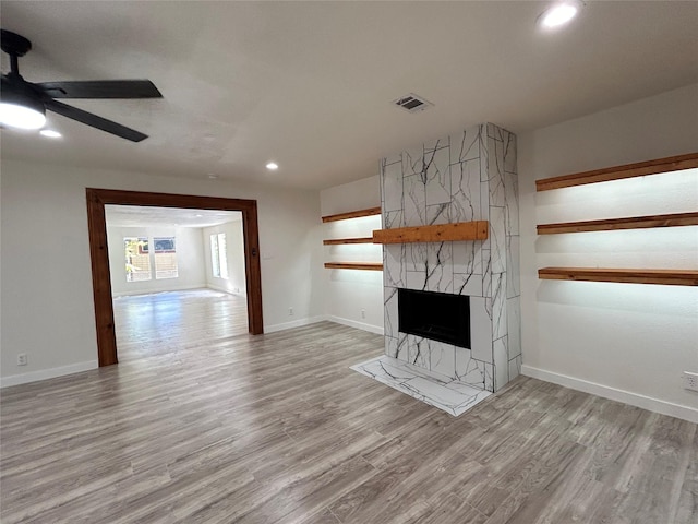 1526 Daniel Dr, Arlington, TX 76010 - unfurnished living room with ceiling fan, recessed lighting, light wood-style flooring, a fireplace, and baseboards