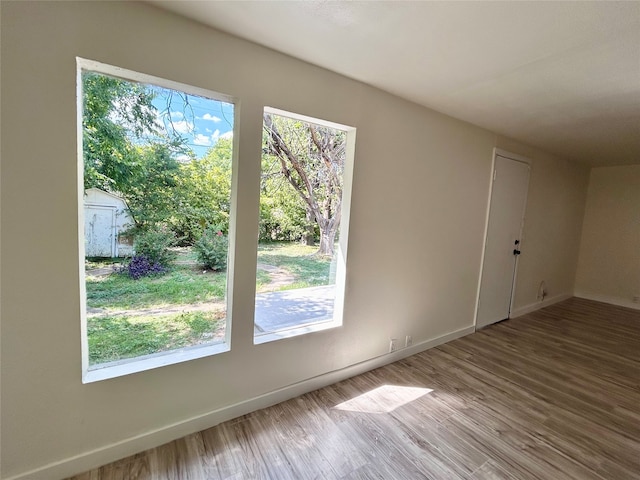 unfurnished room with light hardwood / wood-style floors