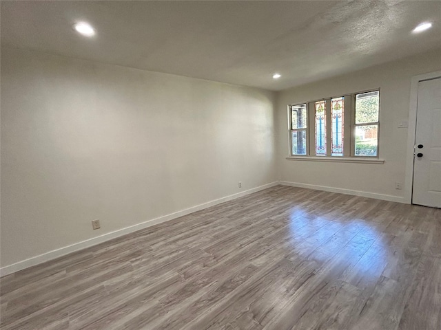 1526 Daniel Dr, Arlington, TX 76010 - unfurnished room featuring wood finished floors, recessed lighting, and baseboards