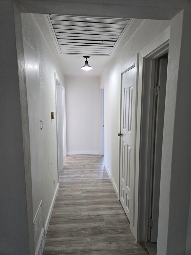 1526 Daniel Dr, Arlington, TX 76010 - hall with wood finished floors, baseboards, and a textured wall