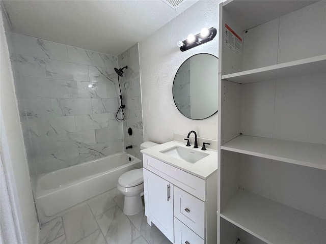 full bathroom with tiled shower / bath, vanity, and toilet