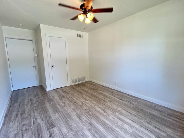 1526 Daniel Dr, Arlington, TX 76010 - unfurnished room featuring a ceiling fan, wood finished floors, and baseboards