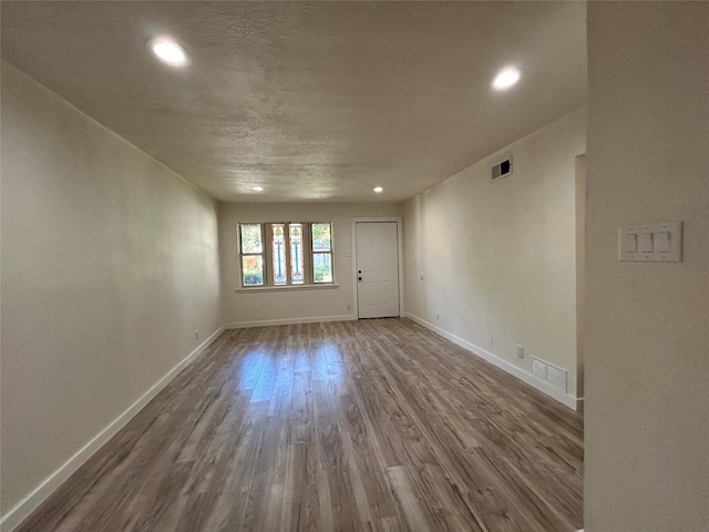 1526 Daniel Dr, Arlington, TX 76010 - empty room featuring dark wood finished floors, recessed lighting, and baseboards