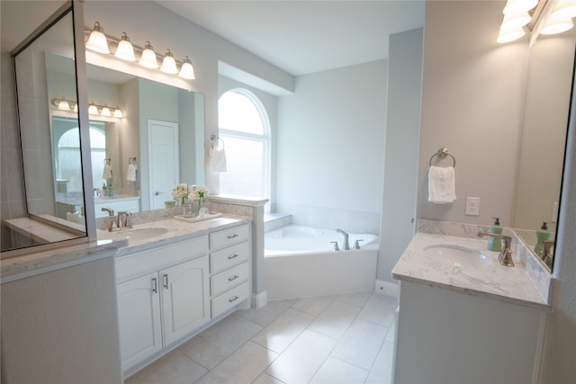 bathroom with vanity, tile patterned floors, and a tub