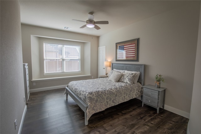 bedroom featuring ceiling fan and dark wood-type flooring