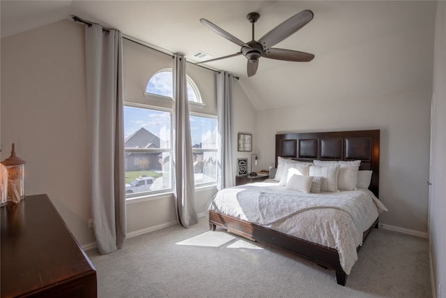 carpeted bedroom featuring lofted ceiling and ceiling fan