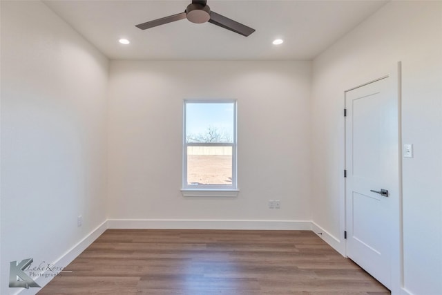 spare room with light wood finished floors, baseboards, a ceiling fan, and recessed lighting