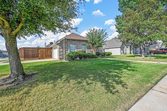 view of front of property with a garage and a front yard