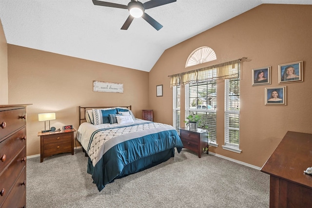 carpeted bedroom with lofted ceiling and ceiling fan