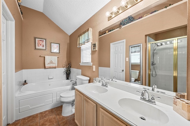 full bathroom featuring vanity, toilet, tile patterned flooring, a textured ceiling, and vaulted ceiling