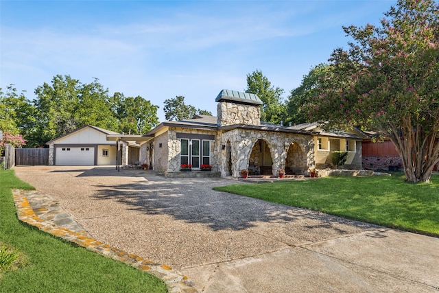 view of front facade featuring a front yard and a garage