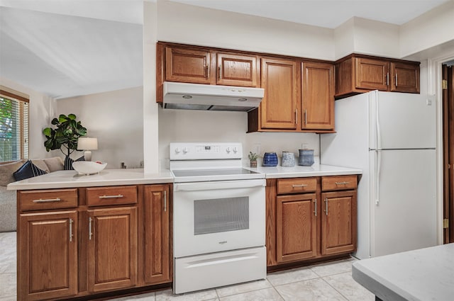 kitchen featuring light tile patterned flooring and white appliances