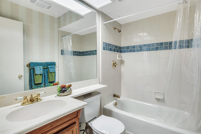 full bathroom with vanity, toilet, and shower / tub combo with curtain