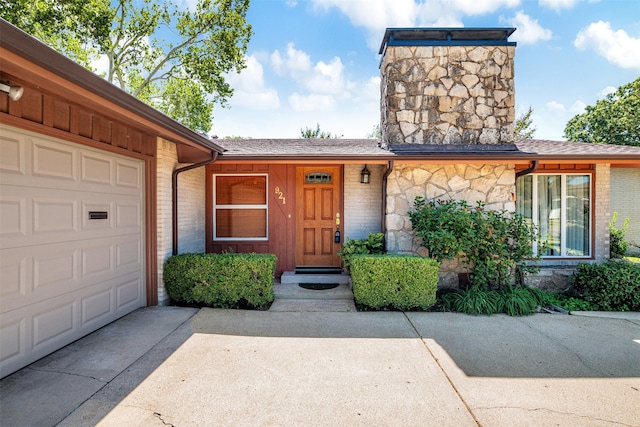 view of exterior entry featuring a garage