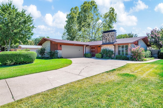 ranch-style house featuring a front yard and a garage