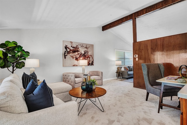 living room with light colored carpet and lofted ceiling with beams