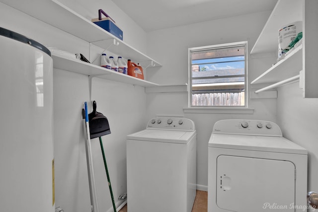 laundry area featuring washing machine and clothes dryer