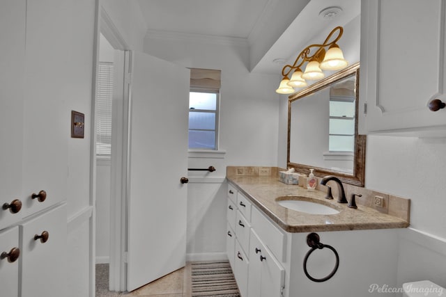 bathroom with vanity, crown molding, and tile patterned flooring