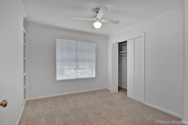 unfurnished bedroom with light carpet, a closet, ornamental molding, and ceiling fan