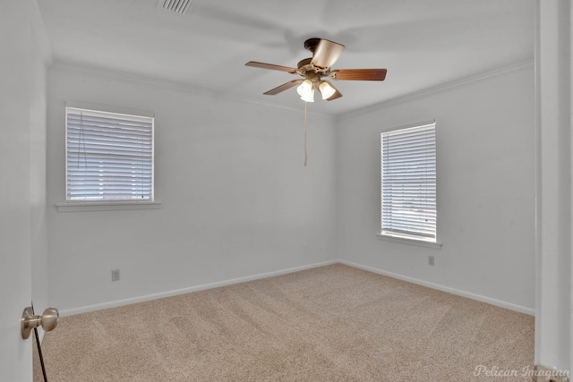 carpeted empty room featuring ceiling fan and ornamental molding