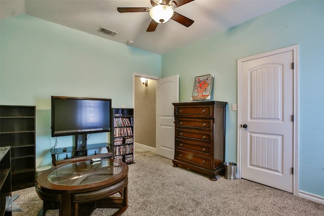 interior space featuring light carpet, lofted ceiling, and ceiling fan