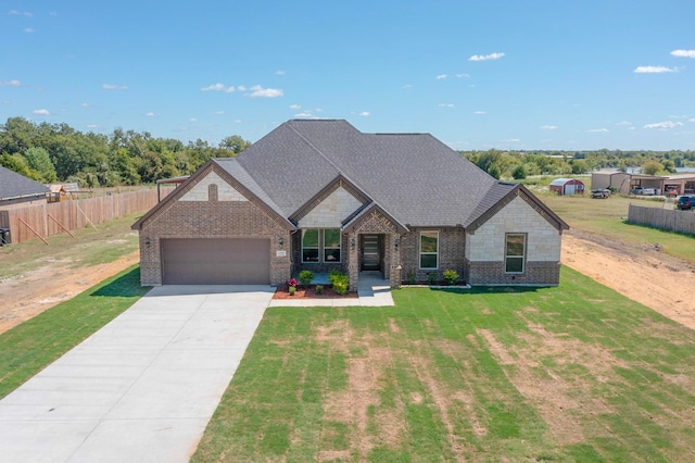 craftsman-style home with a garage and a front yard