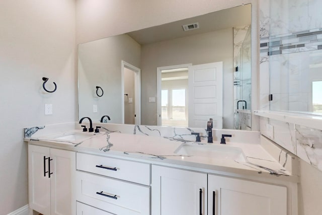 bathroom with vanity and an enclosed shower