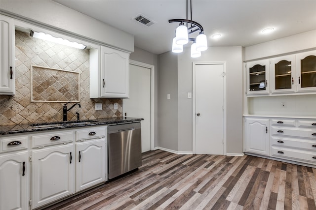 kitchen with pendant lighting, dishwasher, and white cabinetry