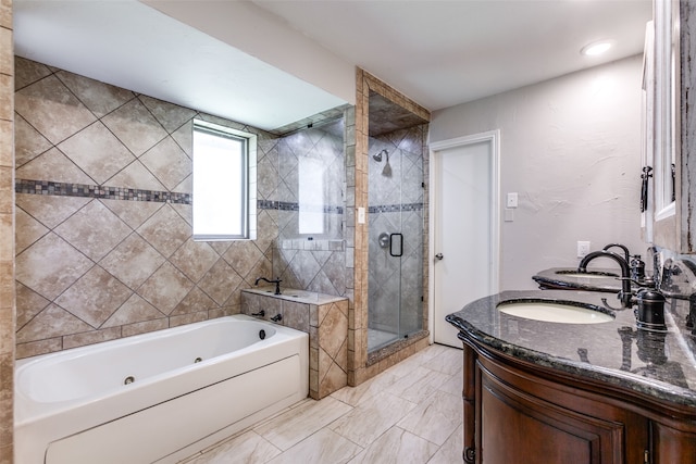 bathroom with independent shower and bath and vanity