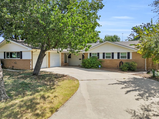 ranch-style house featuring a garage