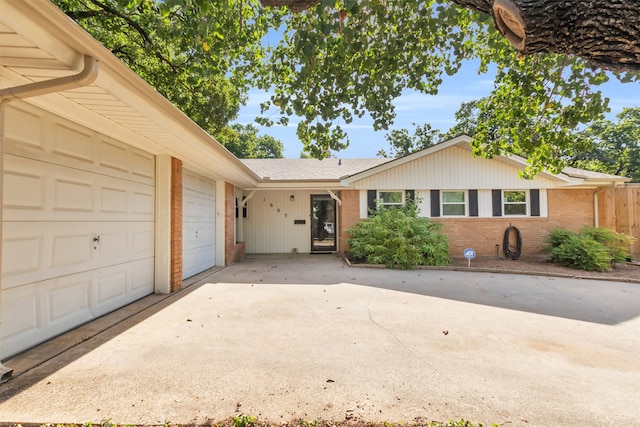 ranch-style home featuring a garage