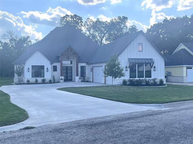 exterior space featuring a front yard and a garage