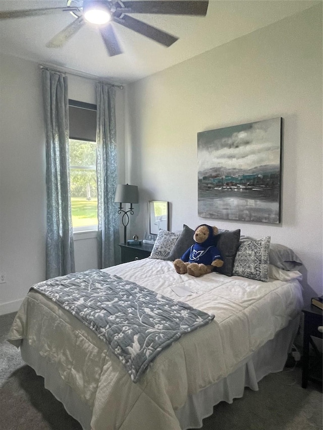 carpeted bedroom with ceiling fan