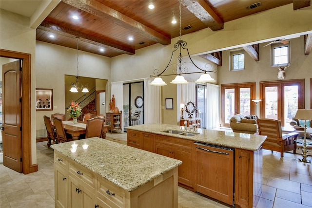 kitchen with french doors, wood ceiling, dishwashing machine, high vaulted ceiling, and an island with sink