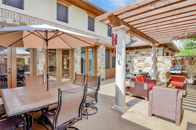 view of patio with a pergola and an outdoor stone fireplace