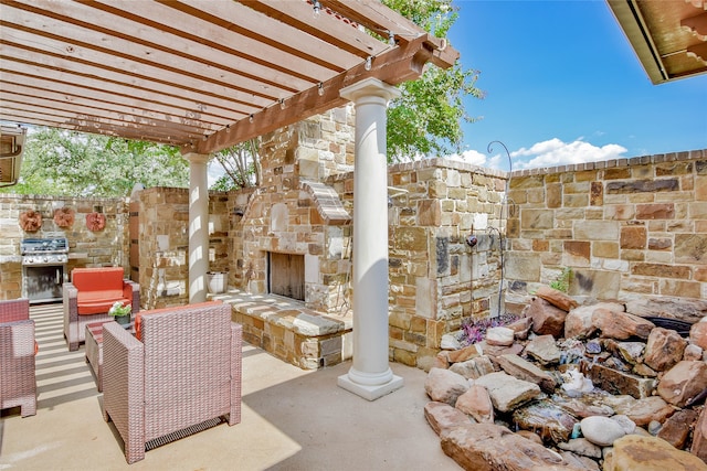 view of patio / terrace with an outdoor stone fireplace