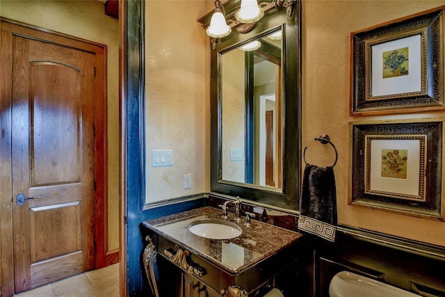 bathroom with tile patterned flooring and vanity