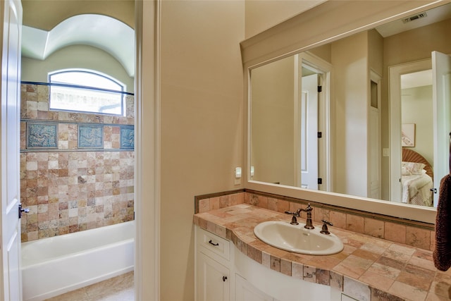 bathroom with vanity and a bathtub