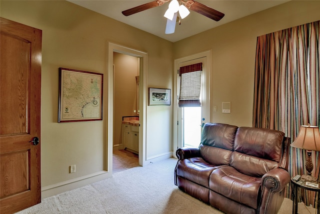 living room featuring light carpet and ceiling fan